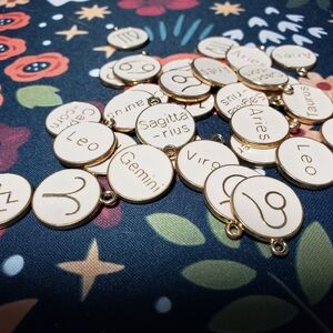 Mixed lot metal zodiac pendants
